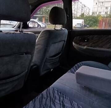 Синий Киа Кларус, объемом двигателя 1.8 л и пробегом 311 тыс. км за 999 $, фото 4 на Automoto.ua