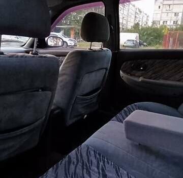 Синий Киа Кларус, объемом двигателя 1.8 л и пробегом 311 тыс. км за 1150 $, фото 1 на Automoto.ua