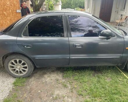 Синій Кіа Кларус, об'ємом двигуна 2 л та пробігом 301 тис. км за 1650 $, фото 2 на Automoto.ua