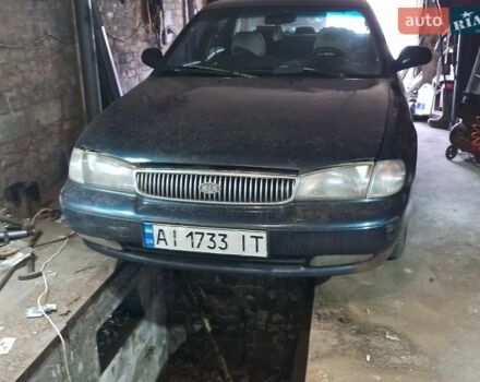 Синий Киа Кларус, объемом двигателя 2 л и пробегом 243 тыс. км за 1500 $, фото 1 на Automoto.ua