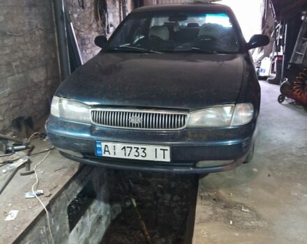 Синій Кіа Кларус, об'ємом двигуна 2 л та пробігом 243 тис. км за 1500 $, фото 1 на Automoto.ua