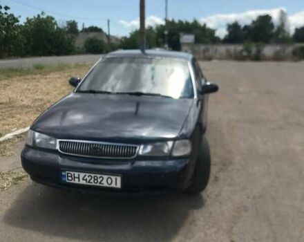 Синій Кіа Кларус, об'ємом двигуна 2 л та пробігом 300 тис. км за 1600 $, фото 1 на Automoto.ua
