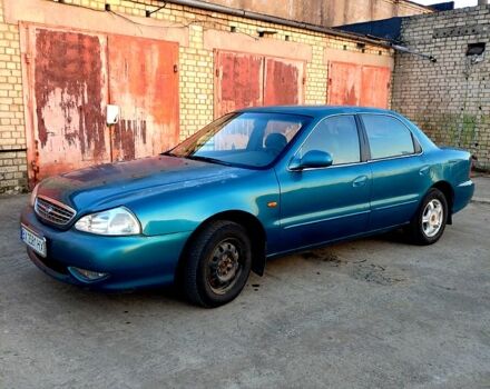 Синій Кіа Кларус, об'ємом двигуна 2 л та пробігом 210 тис. км за 2100 $, фото 1 на Automoto.ua