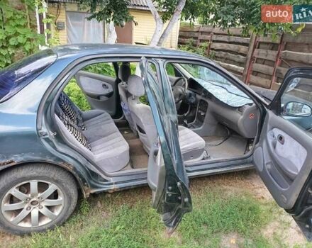 Зеленый Киа Кларус, объемом двигателя 2 л и пробегом 323 тыс. км за 1000 $, фото 7 на Automoto.ua