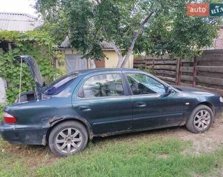 Зеленый Киа Кларус, объемом двигателя 2 л и пробегом 323 тыс. км за 1000 $, фото 2 на Automoto.ua