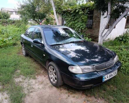 Зелений Кіа Кларус, об'ємом двигуна 2 л та пробігом 323 тис. км за 1000 $, фото 1 на Automoto.ua