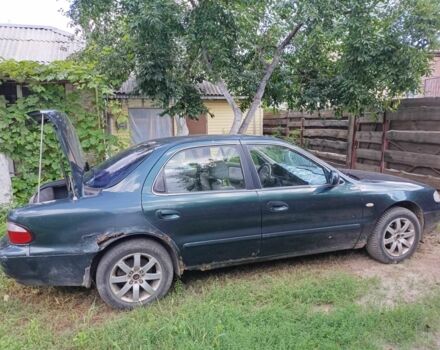 Зелений Кіа Кларус, об'ємом двигуна 2 л та пробігом 323 тис. км за 1000 $, фото 3 на Automoto.ua