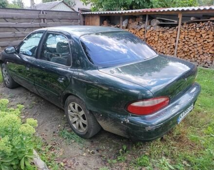 Зелений Кіа Кларус, об'ємом двигуна 2 л та пробігом 323 тис. км за 1000 $, фото 5 на Automoto.ua