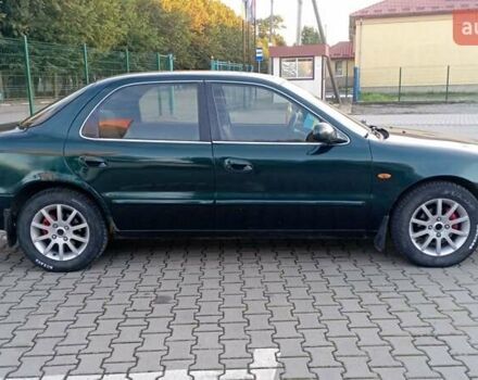 Зелений Кіа Кларус, об'ємом двигуна 1.79 л та пробігом 260 тис. км за 1450 $, фото 6 на Automoto.ua
