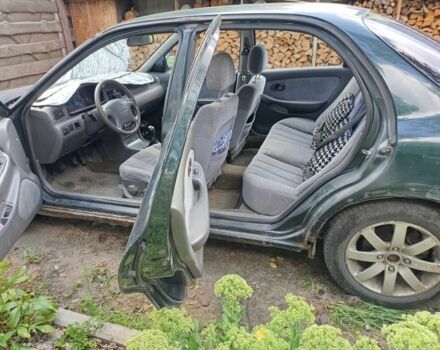 Зелений Кіа Кларус, об'ємом двигуна 2 л та пробігом 323 тис. км за 1000 $, фото 9 на Automoto.ua