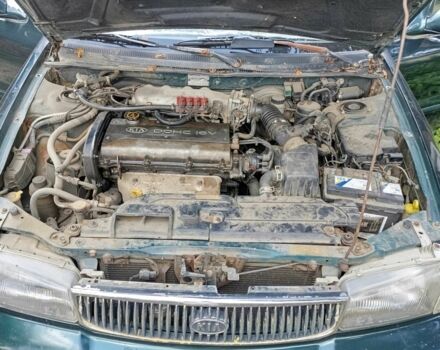 Зелений Кіа Кларус, об'ємом двигуна 2 л та пробігом 323 тис. км за 1000 $, фото 11 на Automoto.ua