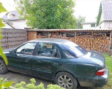 Зелений Кіа Кларус, об'ємом двигуна 2 л та пробігом 323 тис. км за 1000 $, фото 2 на Automoto.ua