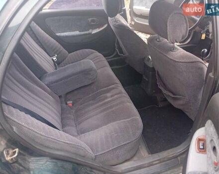 Зелений Кіа Кларус, об'ємом двигуна 2 л та пробігом 320 тис. км за 1250 $, фото 10 на Automoto.ua