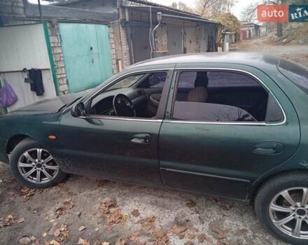 Зелений Кіа Кларус, об'ємом двигуна 2 л та пробігом 320 тис. км за 1250 $, фото 16 на Automoto.ua