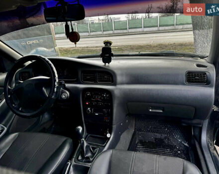 Зеленый Киа Кларус, объемом двигателя 1.79 л и пробегом 304 тыс. км за 1500 $, фото 7 на Automoto.ua