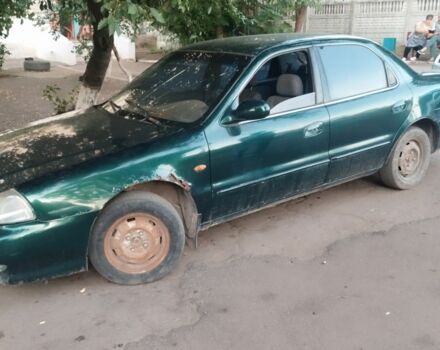 Зеленый Киа Кларус, объемом двигателя 2 л и пробегом 300 тыс. км за 609 $, фото 2 на Automoto.ua
