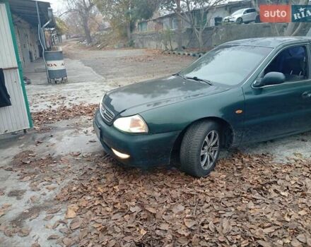 Зелений Кіа Кларус, об'ємом двигуна 2 л та пробігом 320 тис. км за 1250 $, фото 14 на Automoto.ua