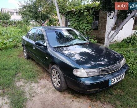 Зелений Кіа Кларус, об'ємом двигуна 2 л та пробігом 323 тис. км за 1000 $, фото 1 на Automoto.ua