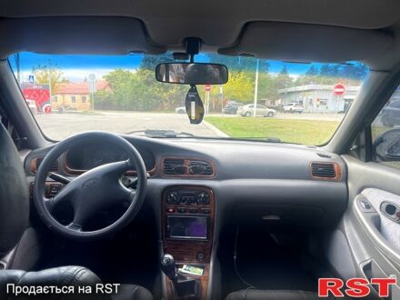 Зеленый Киа Кларус, объемом двигателя 1.8 л и пробегом 200 тыс. км за 2000 $, фото 1 на Automoto.ua