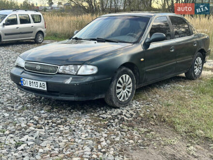 Зеленый Киа Кларус, объемом двигателя 2 л и пробегом 230 тыс. км за 1500 $, фото 1 на Automoto.ua