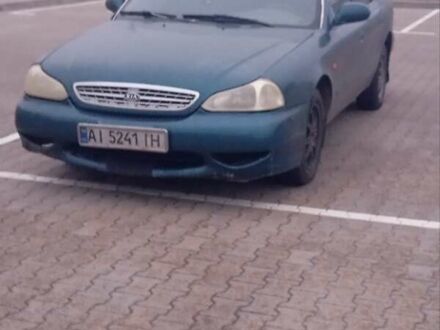 Зелений Кіа Кларус, об'ємом двигуна 2 л та пробігом 258 тис. км за 2000 $, фото 1 на Automoto.ua