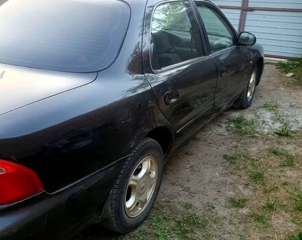 Чорний Кіа Кредос, об'ємом двигуна 2 л та пробігом 315 тис. км за 900 $, фото 5 на Automoto.ua