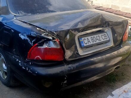 Черный Киа Кредос, объемом двигателя 2 л и пробегом 315 тыс. км за 900 $, фото 1 на Automoto.ua