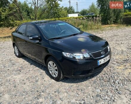 Черный Киа Форте, объемом двигателя 2 л и пробегом 325 тыс. км за 5300 $, фото 1 на Automoto.ua