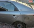 Серый Киа Форте, объемом двигателя 2 л и пробегом 247 тыс. км за 6000 $, фото 14 на Automoto.ua