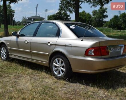Бежевий Кіа Маджентіс, об'ємом двигуна 2 л та пробігом 145 тис. км за 4700 $, фото 3 на Automoto.ua