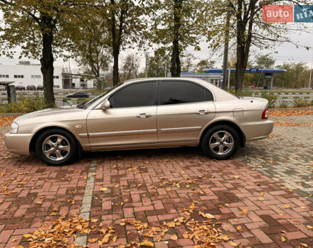 Бежевий Кіа Маджентіс, об'ємом двигуна 2 л та пробігом 165 тис. км за 3900 $, фото 12 на Automoto.ua
