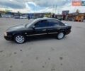 Черный Киа Маджентис, объемом двигателя 2 л и пробегом 350 тыс. км за 3899 $, фото 1 на Automoto.ua