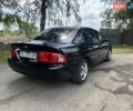 Черный Киа Маджентис, объемом двигателя 2 л и пробегом 72 тыс. км за 5600 $, фото 1 на Automoto.ua
