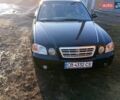 Черный Киа Маджентис, объемом двигателя 2 л и пробегом 320 тыс. км за 3900 $, фото 1 на Automoto.ua