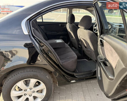 Черный Киа Маджентис, объемом двигателя 2 л и пробегом 260 тыс. км за 5400 $, фото 12 на Automoto.ua