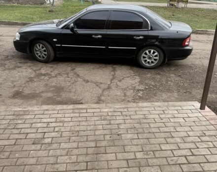 Чорний Кіа Маджентіс, об'ємом двигуна 2 л та пробігом 270 тис. км за 3296 $, фото 3 на Automoto.ua