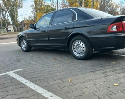 Чорний Кіа Маджентіс, об'ємом двигуна 2 л та пробігом 195 тис. км за 3500 $, фото 5 на Automoto.ua