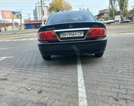 Чорний Кіа Маджентіс, об'ємом двигуна 2 л та пробігом 195 тис. км за 3500 $, фото 4 на Automoto.ua