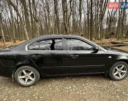 Чорний Кіа Маджентіс, об'ємом двигуна 2.66 л та пробігом 218 тис. км за 4600 $, фото 12 на Automoto.ua