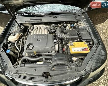 Чорний Кіа Маджентіс, об'ємом двигуна 2.66 л та пробігом 218 тис. км за 4600 $, фото 28 на Automoto.ua