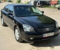Черный Киа Маджентис, объемом двигателя 2 л и пробегом 267 тыс. км за 5200 $, фото 1 на Automoto.ua
