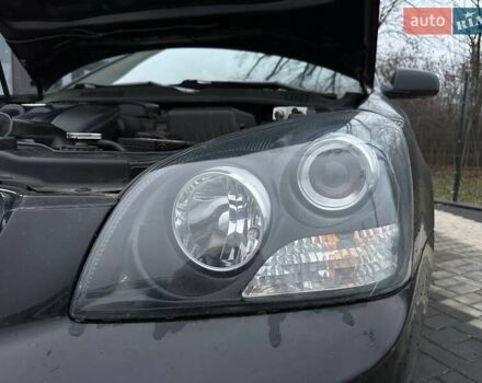 Чорний Кіа Маджентіс, об'ємом двигуна 2 л та пробігом 302 тис. км за 5800 $, фото 38 на Automoto.ua