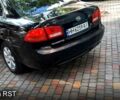 Чорний Кіа Маджентіс, об'ємом двигуна 2 л та пробігом 215 тис. км за 5750 $, фото 1 на Automoto.ua