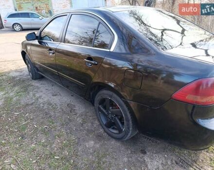 Черный Киа Маджентис, объемом двигателя 2 л и пробегом 400 тыс. км за 3400 $, фото 6 на Automoto.ua