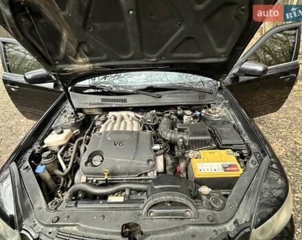 Чорний Кіа Маджентіс, об'ємом двигуна 2.66 л та пробігом 218 тис. км за 4600 $, фото 27 на Automoto.ua