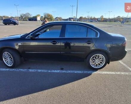 Чорний Кіа Маджентіс, об'ємом двигуна 2 л та пробігом 373 тис. км за 4500 $, фото 1 на Automoto.ua