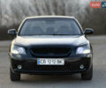 Черный Киа Маджентис, объемом двигателя 2 л и пробегом 305 тыс. км за 5400 $, фото 2 на Automoto.ua