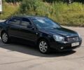 Чорний Кіа Маджентіс, об'ємом двигуна 2 л та пробігом 323 тис. км за 5499 $, фото 1 на Automoto.ua