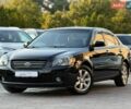 Чорний Кіа Маджентіс, об'ємом двигуна 2 л та пробігом 190 тис. км за 5500 $, фото 1 на Automoto.ua