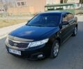 Черный Киа Маджентис, объемом двигателя 2 л и пробегом 294 тыс. км за 5600 $, фото 1 на Automoto.ua